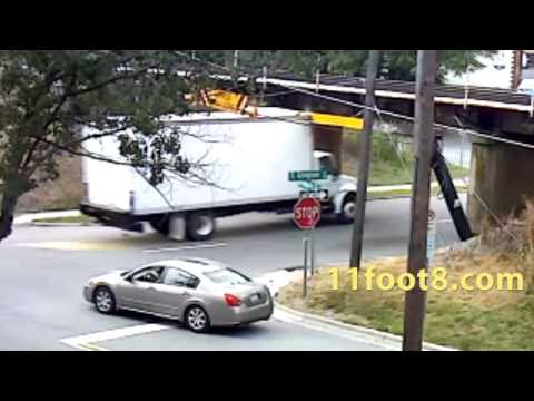 Speeding truck pops a wheelie at the 11foot8 bridge