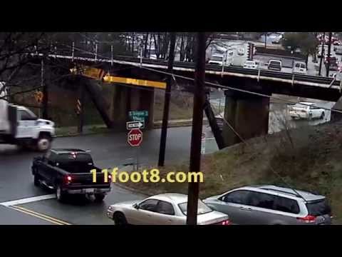 Flatbed truck loses load at the 11foot8 bridge