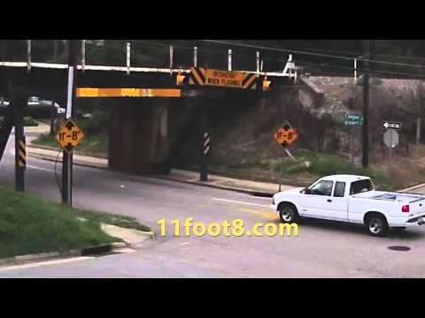 Truck driver makes a bad move at the 11foot8 bridge