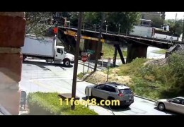 Boxtruck gets peeled open and stuck at the 11foot8 bridge