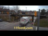 Pedestrian escapes reefer truck carnage at the 11foot8 bridge