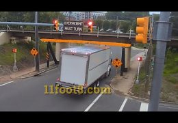 Reefer truck gets stuck under the 11foot8+8 bridge