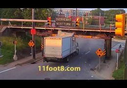 Red-light runner crashes truck into the 11foot8 bridge